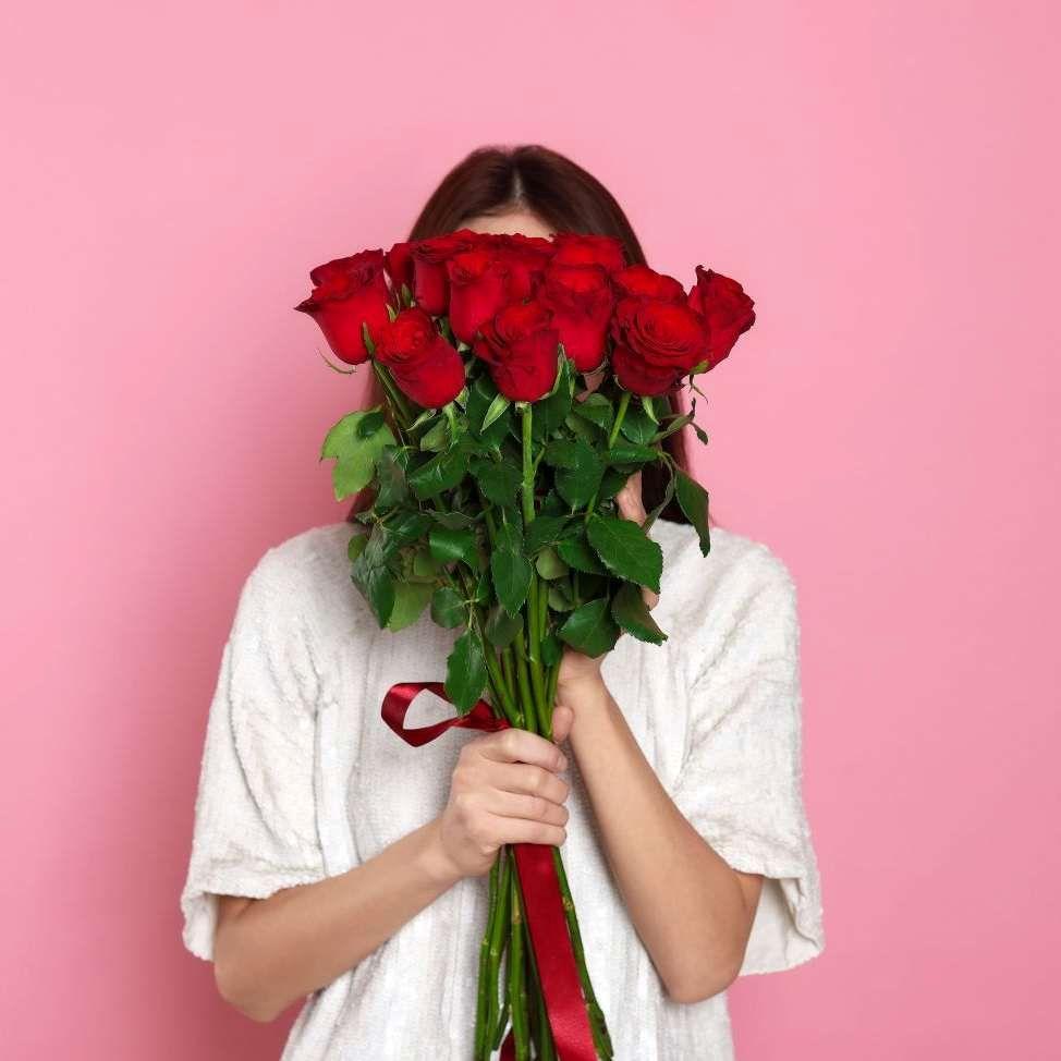 A girl holding flowers.